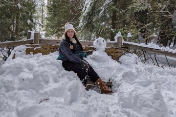 a person sitting on the snow