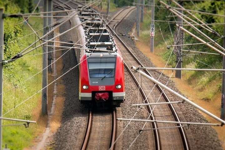 a long train is coming down the railroad tracks